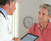 Man discussing medical results with doctor
