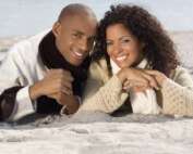 Couple smiling on the beach
